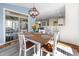 Charming breakfast nook with natural light, stylish light fixture, and view to the kitchen bar at 1137 Fanning Dr, Wake Forest, NC 27587