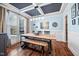 Inviting dining room featuring a unique coffered ceiling, rustic wood table and bench, and ample natural light at 1137 Fanning Dr, Wake Forest, NC 27587