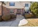 Inviting front entrance with stone accents, double doors adorned with wreaths, and professionally landscaped surroundings at 1137 Fanning Dr, Wake Forest, NC 27587