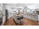 Bright and spacious kitchen with a large center island, hardwood floors, and stainless steel appliances at 1137 Fanning Dr, Wake Forest, NC 27587