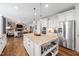 Bright kitchen featuring granite countertops, stainless steel appliances, and an open concept design at 1137 Fanning Dr, Wake Forest, NC 27587