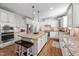 Bright kitchen features a large island, stainless steel appliances, and custom white cabinets at 1137 Fanning Dr, Wake Forest, NC 27587