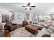 Spacious living room featuring hardwood floors, a stone fireplace, and an open floor plan at 1137 Fanning Dr, Wake Forest, NC 27587
