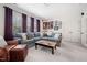 Comfortable living room with a large sectional sofa, wet bar, and natural light at 1137 Fanning Dr, Wake Forest, NC 27587