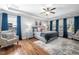 Serene primary bedroom with hardwood floors, tray ceiling, and lots of natural light at 1137 Fanning Dr, Wake Forest, NC 27587