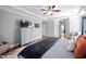 Spacious primary bedroom featuring hardwood floors, ceiling fan, and en-suite bathroom access at 1137 Fanning Dr, Wake Forest, NC 27587