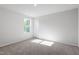 Bright bedroom with neutral colored carpet, paint, and trim at 119 Grove Township Way, Angier, NC 27501