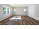 Spacious bedroom boasts hardwood floors, multiple windows, and a bright, airy feel at 119 Grove Township Way, Angier, NC 27501