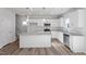 Well-appointed kitchen with stainless steel appliances, granite countertops, and an island at 119 Grove Township Way, Angier, NC 27501