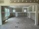 Large room featuring primed walls, ceilings, framing elements and large windows at 119 Grove Township Way, Angier, NC 27501