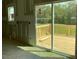 Large sliding glass doors open from the room to a wood deck at 119 Grove Township Way, Angier, NC 27501