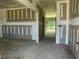 Spacious room featuring primed walls, ceilings, and visible framing elements at 119 Grove Township Way, Angier, NC 27501