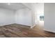 Open-concept living room with laminate flooring, white trim, and natural light from windows at 119 Grove Township Way, Angier, NC 27501
