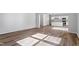 Open living room showcases hardwood floors and light filled space at 119 Grove Township Way, Angier, NC 27501