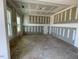 Bright room featuring primed walls, ceilings, framing elements and large windows at 119 Grove Township Way, Angier, NC 27501