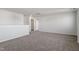 Neutral paint and carpet in the spacious upper level loft area at 119 Grove Township Way, Angier, NC 27501