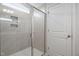 Glass enclosed tile shower with built in storage space at 119 Grove Township Way, Angier, NC 27501