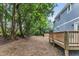 A spacious backyard and wooden deck offer ample space for outdoor activities and enjoying the natural surroundings at 1521 Chapel Hill Rd, Durham, NC 27701
