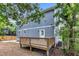 Newly constructed wooden deck overlooks a spacious backyard, perfect for outdoor entertaining and relaxation at 1521 Chapel Hill Rd, Durham, NC 27701