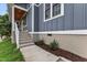Inviting front entrance with newly laid sidewalk leading to the porch steps and landscaped garden bed at 1521 Chapel Hill Rd, Durham, NC 27701