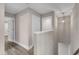 Bright hallway features wood floors and neutral walls, and a modern light fixture at 1521 Chapel Hill Rd, Durham, NC 27701
