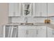 This kitchen showcases stainless steel appliances, white cabinets, granite countertops, and a subway tile backsplash at 1521 Chapel Hill Rd, Durham, NC 27701