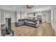 Spacious open floor plan living space showcasing a comfortable couch, dining area, and bright kitchen at 1521 Chapel Hill Rd, Durham, NC 27701