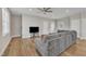 Bright and open floor plan living space features hardwood floors and neutral colored walls and trim at 1521 Chapel Hill Rd, Durham, NC 27701