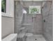 Elegant glass walk-in shower features gray tile surround and shower bench at 1521 Chapel Hill Rd, Durham, NC 27701