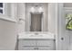 Bright bathroom with modern vanity, mirror and fixtures at 1521 Chapel Hill Rd, Durham, NC 27701