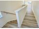 Bright hallway featuring hardwood floors leading to a living space with multiple windows at 169 Steel Springs Lane Rd # 17, Angier, NC 27501