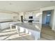 Bright and spacious kitchen with white cabinets, granite countertops, and large kitchen island at 169 Steel Springs Lane Rd # 17, Angier, NC 27501
