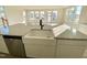 Gourmet kitchen island with a large white farmhouse sink, stainless steel dishwasher, and granite countertops at 169 Steel Springs Lane Rd # 17, Angier, NC 27501