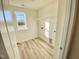 Featuring hardwood floors, bright natural light and a metal shelf, this laundry room is amazing at 169 Steel Springs Lane Rd # 17, Angier, NC 27501