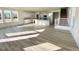 Open concept living area with luxury vinyl plank flooring offering views of the kitchen and staircase at 169 Steel Springs Lane Rd # 17, Angier, NC 27501