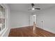 Bright bedroom featuring hardwood floors, neutral paint, a ceiling fan and natural light at 1804 Beverly Rd, Rocky Mount, NC 27801
