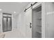 Pantry view featuring a modern barn door, ample shelving space, and a clean, organized layout at 1804 Beverly Rd, Rocky Mount, NC 27801