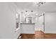 Bright open floor plan featuring hardwood floors, a white kitchen, and sliding barn door at 1804 Beverly Rd, Rocky Mount, NC 27801