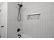 Modern shower featuring white subway tile and black fixtures and hardware at 1804 Beverly Rd, Rocky Mount, NC 27801