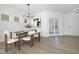Cozy dining room with a table for six, contemporary lighting, and direct access to the entrance at 185 Horseshoe Pl # 54, Angier, NC 27501