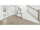 Foyer area boasting neutral flooring, staircase, white walls, and decorative accent pieces at 185 Horseshoe Pl # 54, Angier, NC 27501