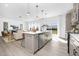 Contemporary kitchen with stainless steel appliances, a center island with seating, and an open layout to the living area at 185 Horseshoe Pl # 54, Angier, NC 27501