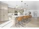 Open kitchen featuring a spacious island with bar seating, modern light fixtures, and ample cabinetry at 185 Horseshoe Pl # 54, Angier, NC 27501