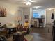 The naturally lit living room flows to kitchen with bar seating, with multiple doors to other rooms at 1911 Wolftech Ln # 303, Raleigh, NC 27603