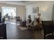 Inviting living room with natural light and open access to the dining area, with ceiling fan at 1911 Wolftech Ln # 303, Raleigh, NC 27603