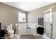 A bathroom featuring a shower, jacuzzi tub, and a window providing natural light at 1952 Grassy Banks Dr, Raleigh, NC 27610