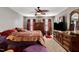 Bedroom featuring a ceiling fan, windows, and red curtains at 1952 Grassy Banks Dr, Raleigh, NC 27610
