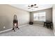 Bedroom with a window and ceiling fan featuring carpet at 1952 Grassy Banks Dr, Raleigh, NC 27610