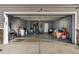 Open garage featuring gray walls and a concrete floor with some items stored inside at 1952 Grassy Banks Dr, Raleigh, NC 27610