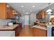Updated kitchen with stainless steel appliances, hardwood flooring and abundant wood cabinets at 1952 Grassy Banks Dr, Raleigh, NC 27610